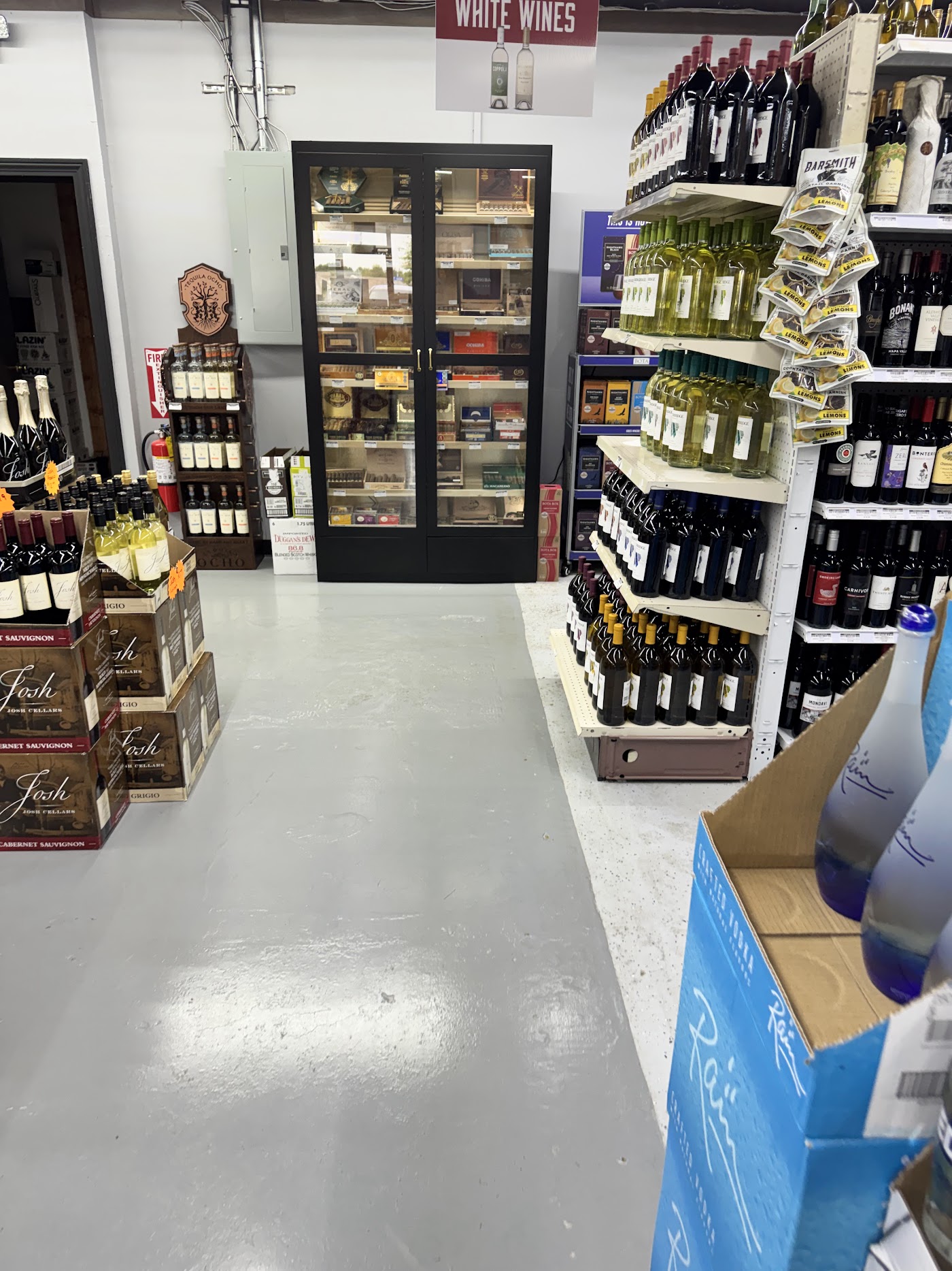 Wine aisle with a cigar humidor case